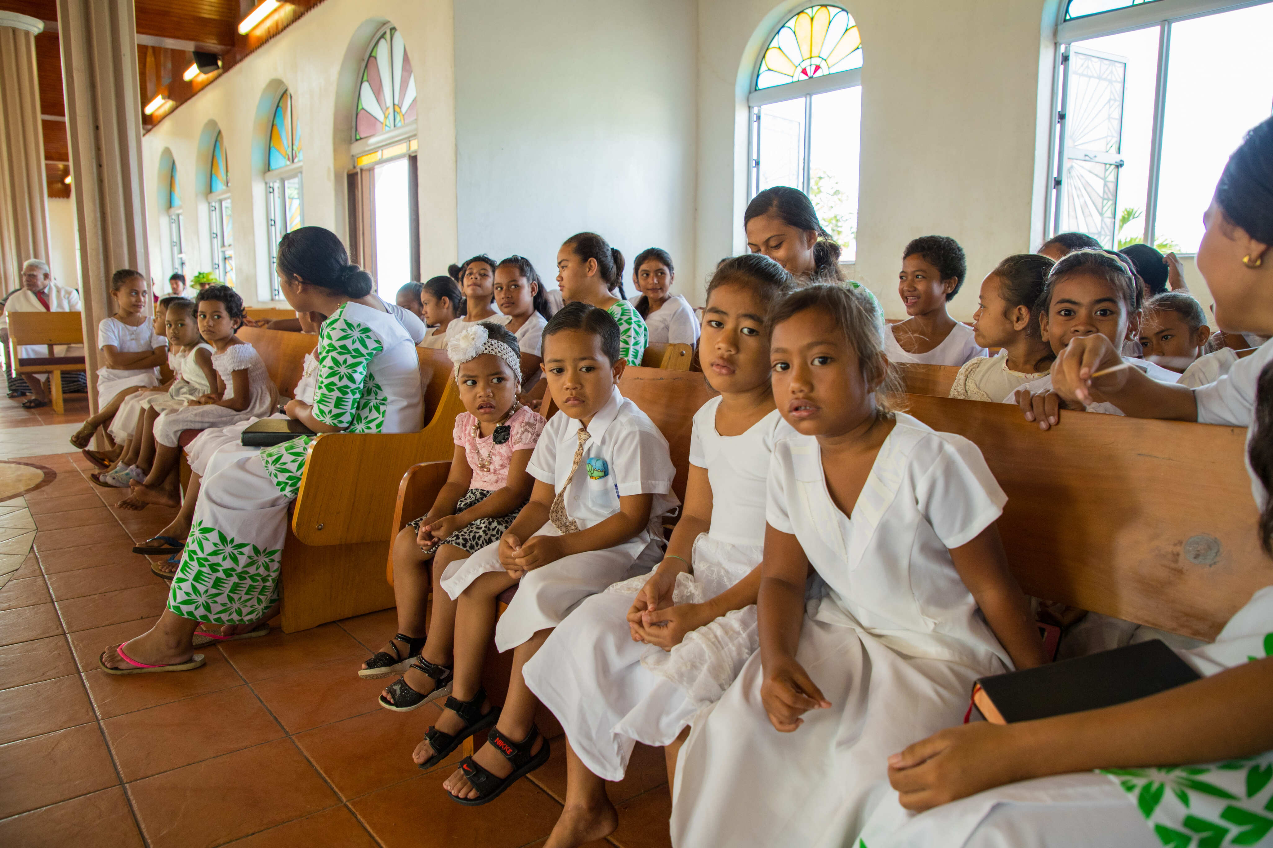 Samoa church service kids in church in Samoa dressed in white