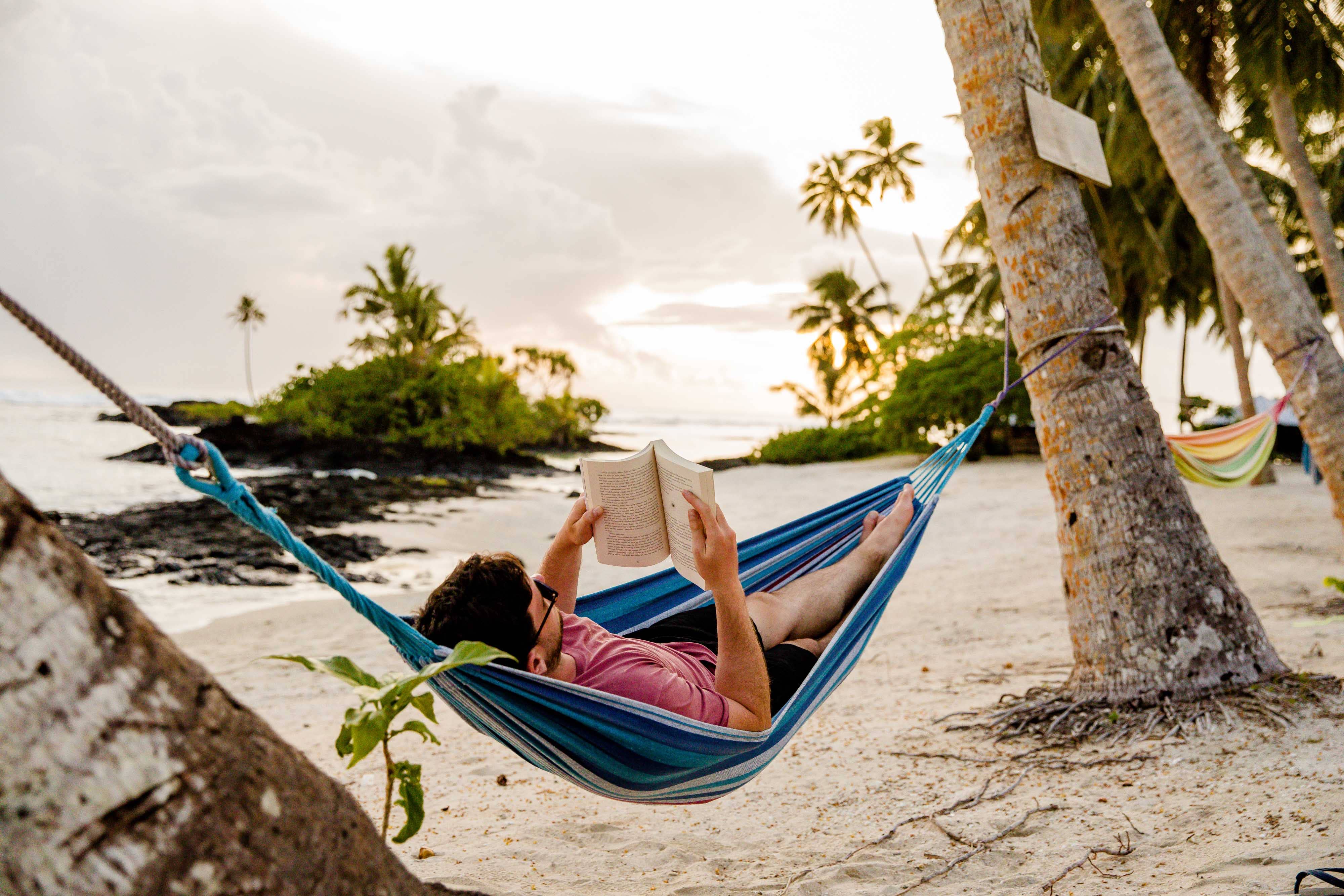 Lazing in a hammock on Matareva Beach Matareva Beach Hammock